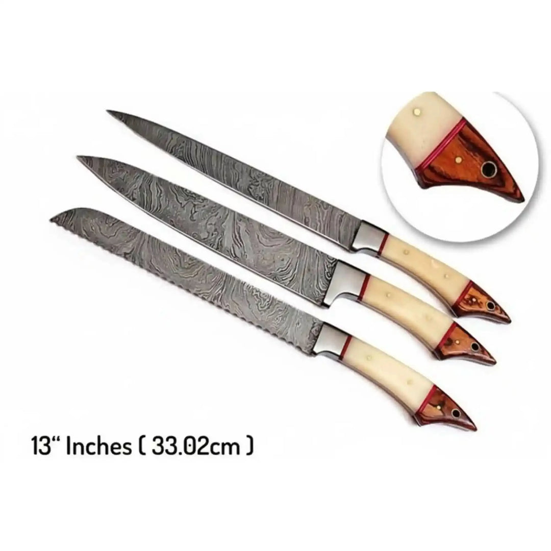 Rustic artisan culinary blades combining ivory bone grips, red accent liners, and patterned Damascus steel finishes.