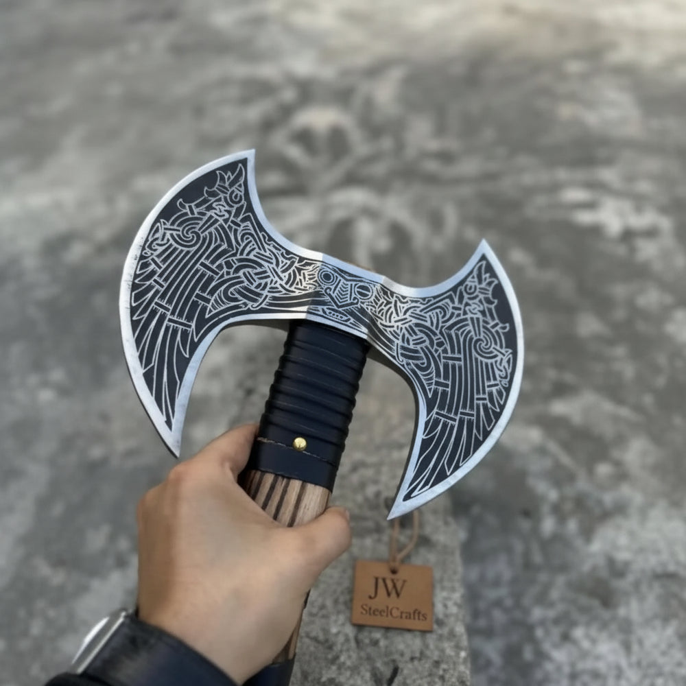 Striking Norse double-headed axe with artistic blade engravings and striped hardwood handle design.