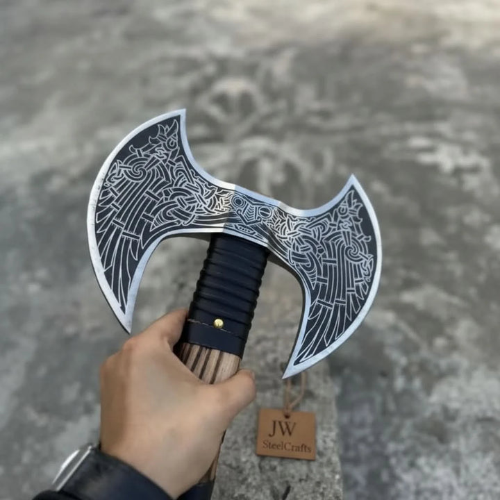 Striking Norse double-headed axe with artistic blade engravings and striped hardwood handle design.