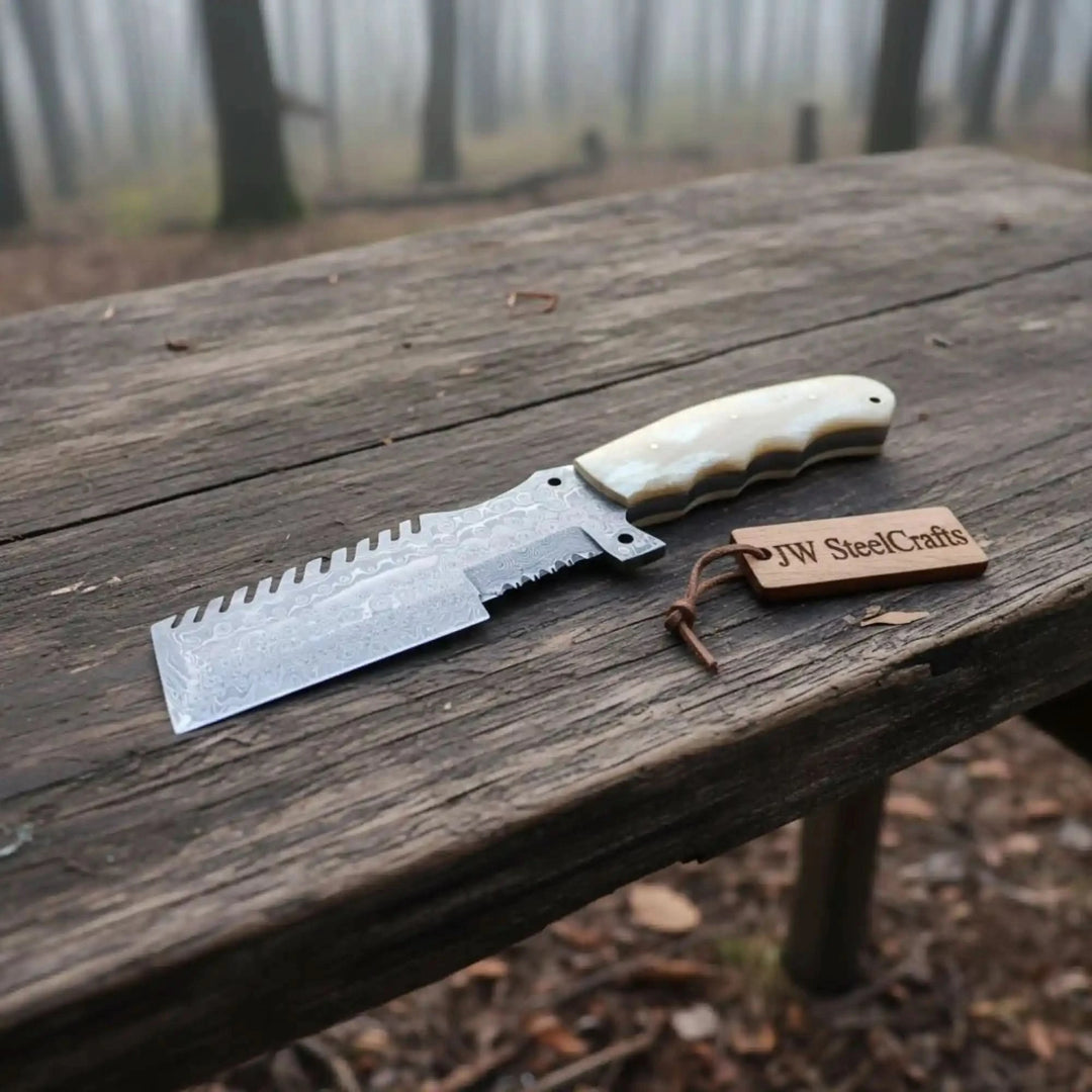 Weathered table Damascus cleaver product photo showing a wide patterned blade and branded wooden tag