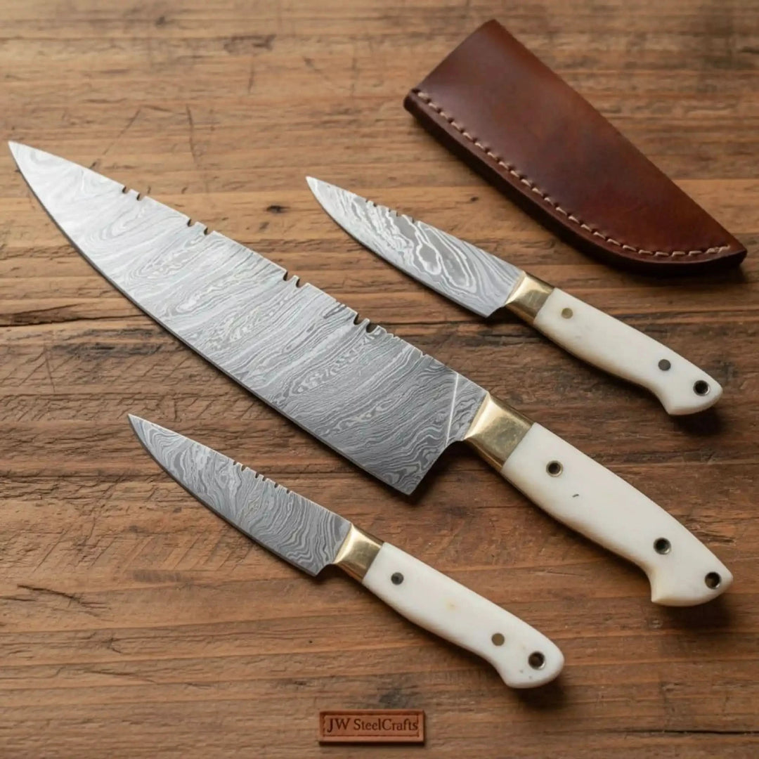 Decorative layered steel blades highlight the handcrafted artisan design of the knife collection.