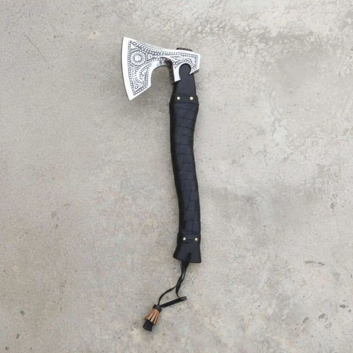 Pyreclaw-themed Nordic combat hatchet featuring ornate silver steel carvings and rugged outdoor styling.