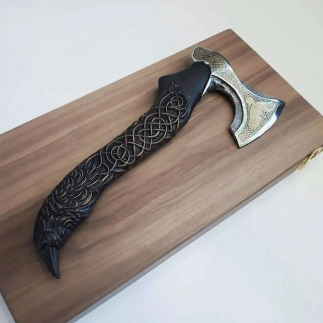 Pyrethorn-themed Nordic combat axe featuring decorative Viking engravings and handcrafted black knotwork grip.