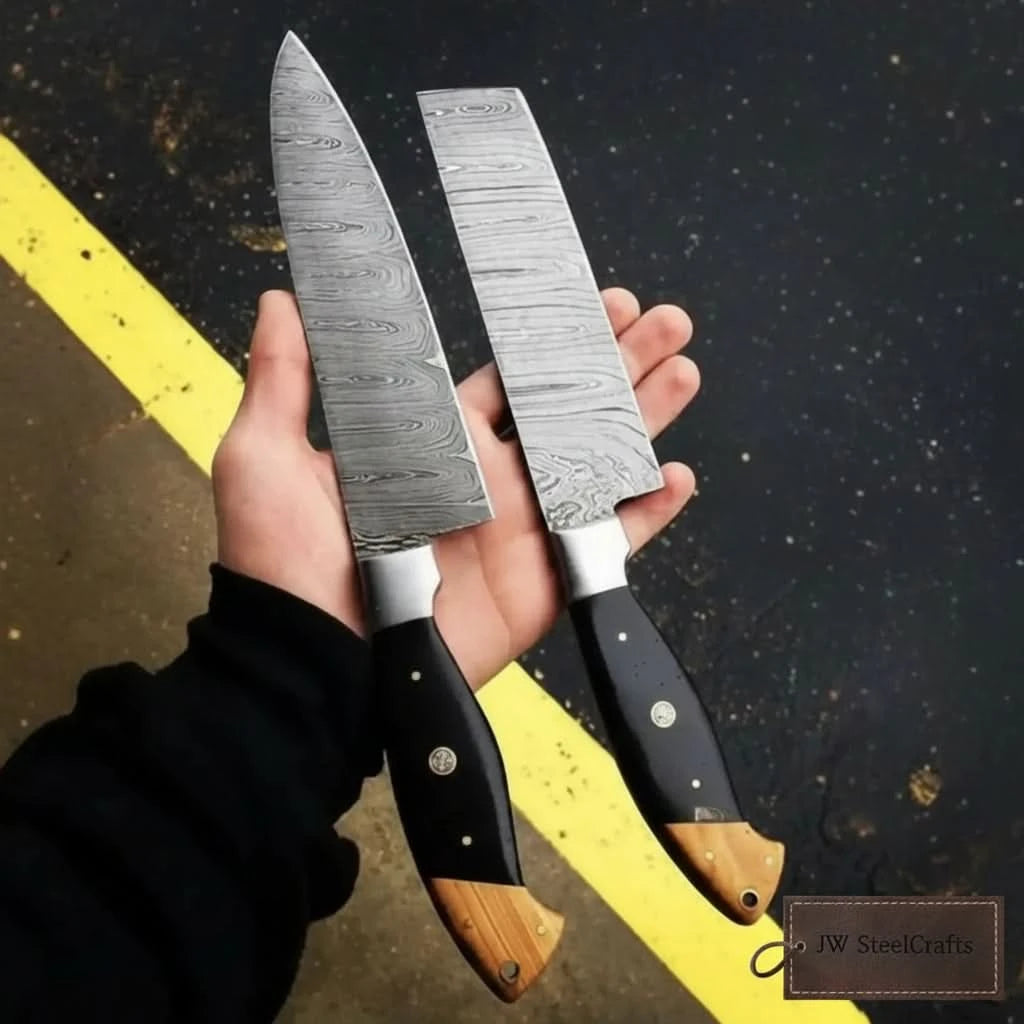 Layered steel knife pair outdoor photo showing blade patterns and ergonomic handles