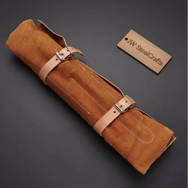 Premium leather cutlery carrier featuring adjustable straps and reinforced rolled construction for portability and protection.