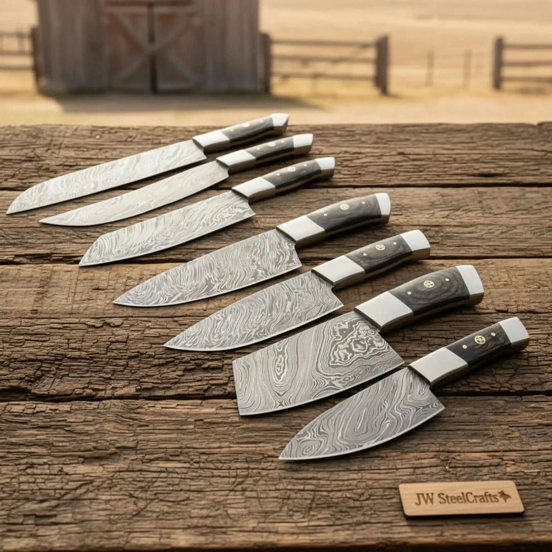 Dark handle chef and paring knives featuring layered steel craftsmanship.