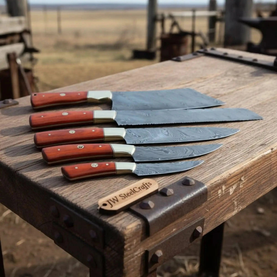 Modern Damascus chef knife lineup captured in outdoor ranch workshop atmosphere with rustic earthy tones.