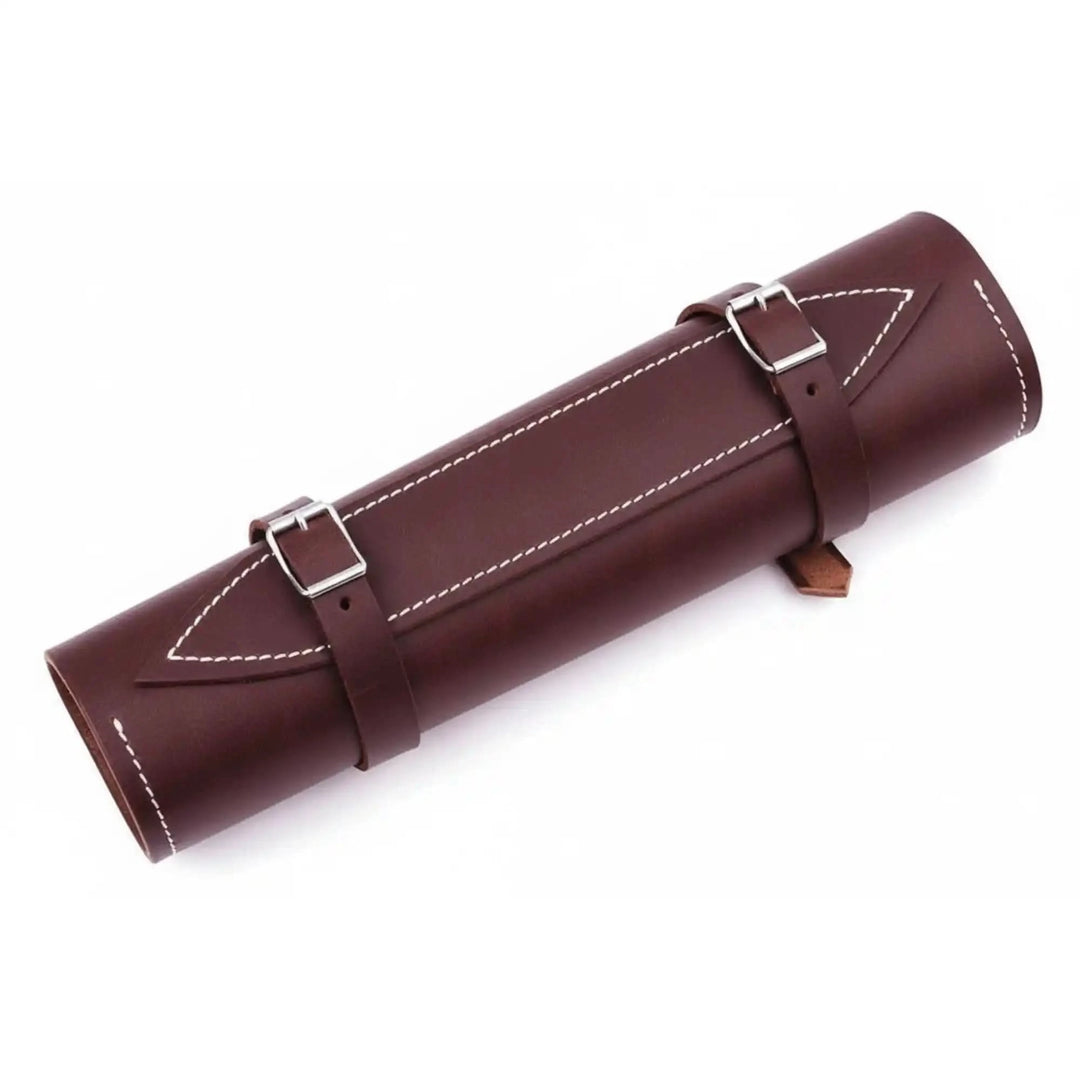Luxury leather chef accessory with dual fastening straps and decorative contrast stitching against white backdrop.