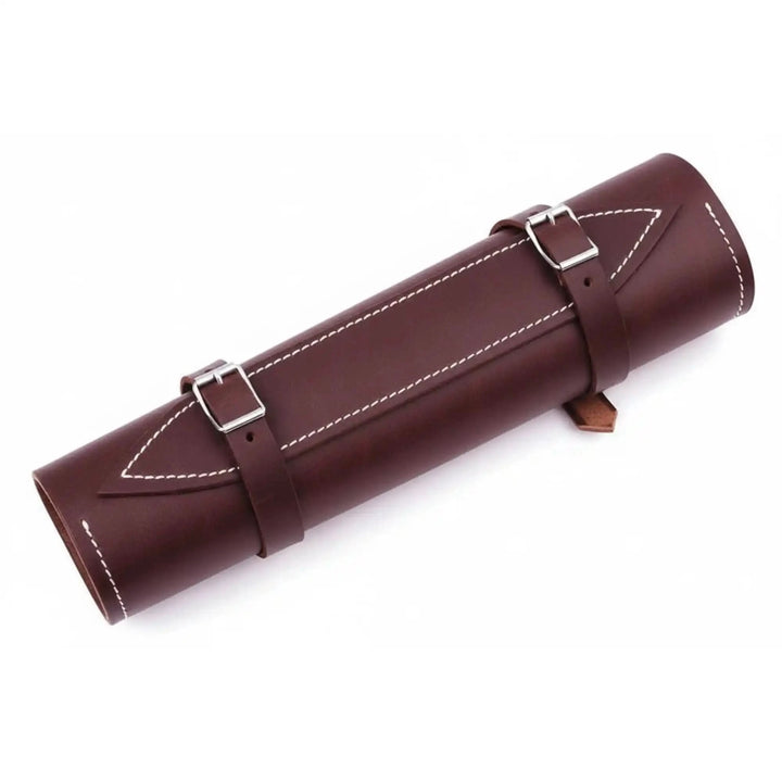 Luxury leather chef accessory with dual fastening straps and decorative contrast stitching against white backdrop.