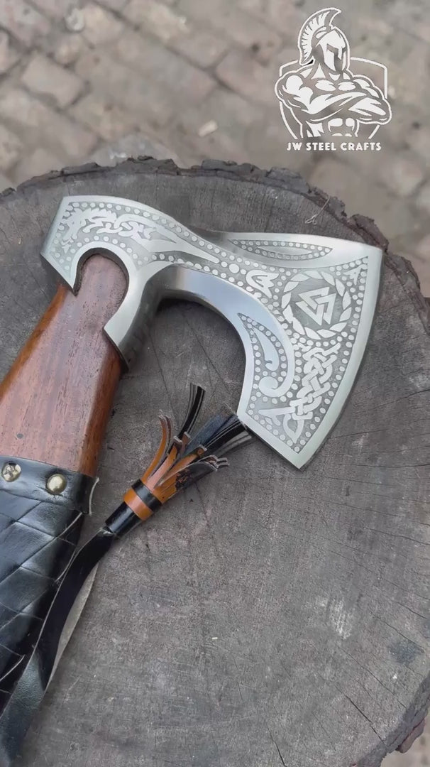Quickshade-inspired Viking battle axe video showcasing handcrafted leather sheath and rustic wooden handle textures.