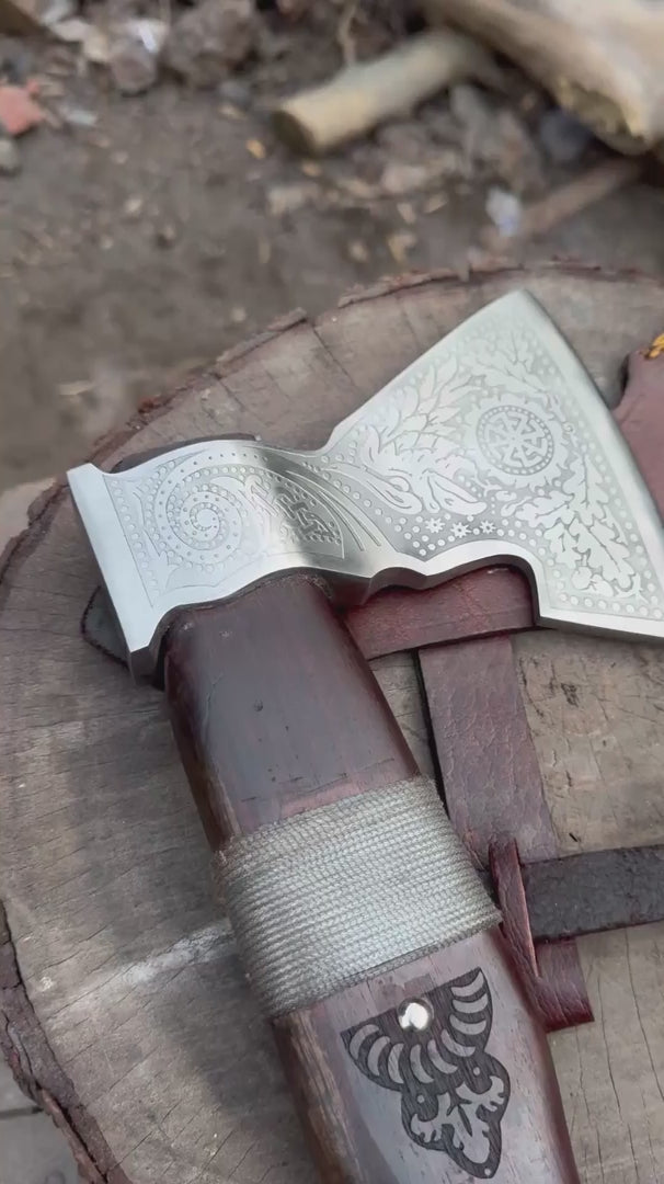 Ashengrave-inspired Viking ornate axe blade video featuring intricate Nordic floral engravings and polished silver steel details.