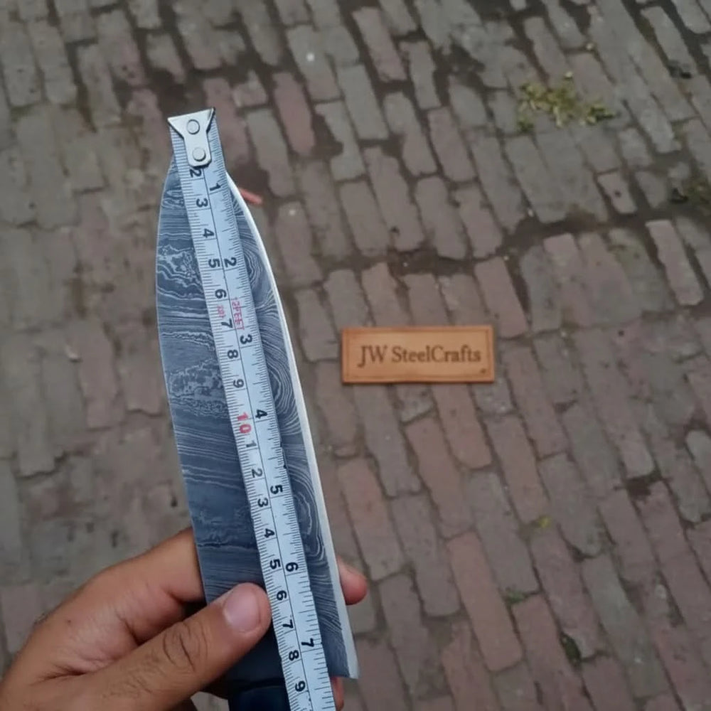 Steel pattern blade size check using measuring tape on a handcrafted kitchen knife