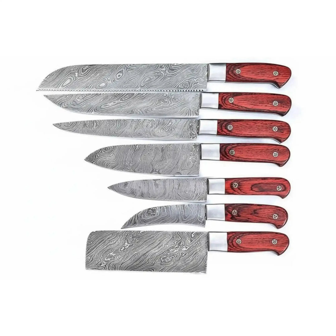 Flat layout of Damascus kitchen knives with red wooden handles and textured steel blades