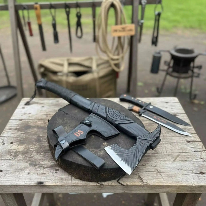 Viking battle axe used for carving during outdoor bushcraft camp session
