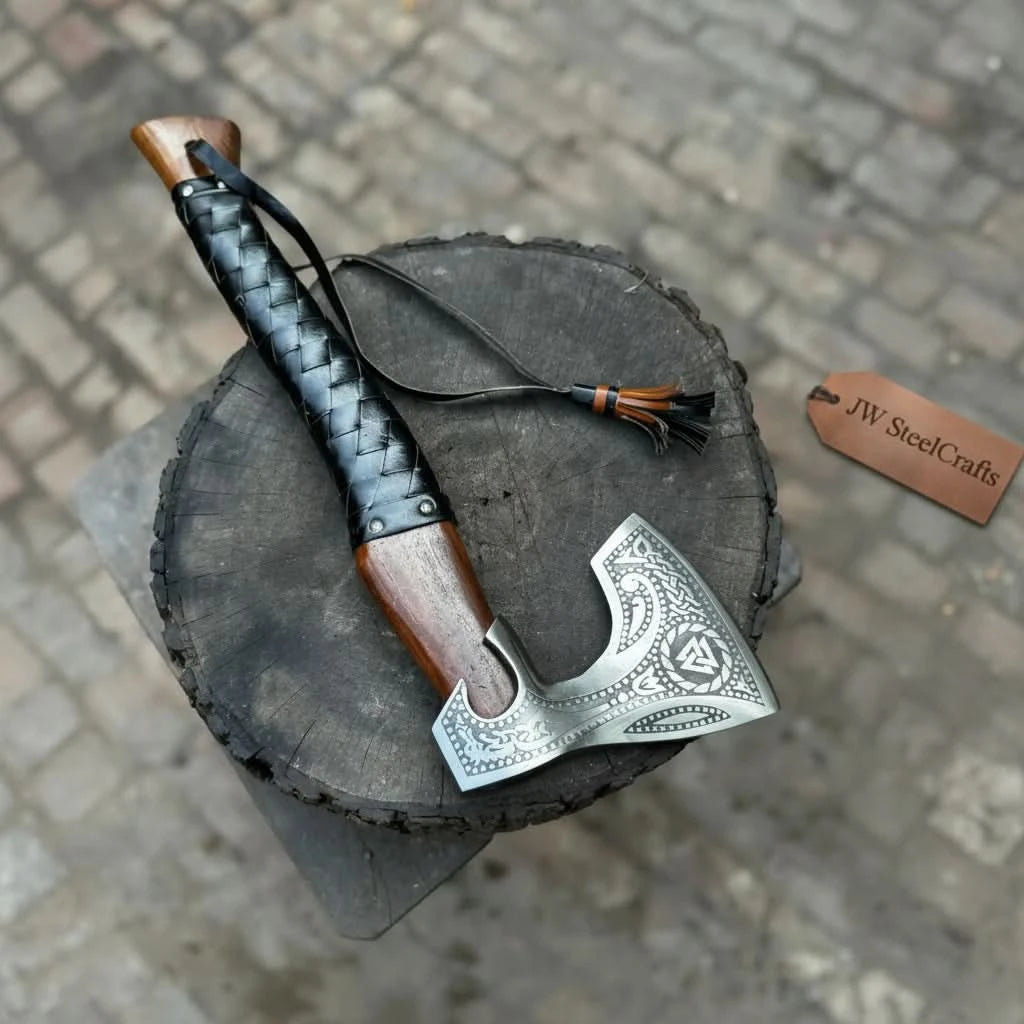 Ravenforge-themed Norse camp hatchet displaying tactical black grip and handcrafted outdoor axe craftsmanship.