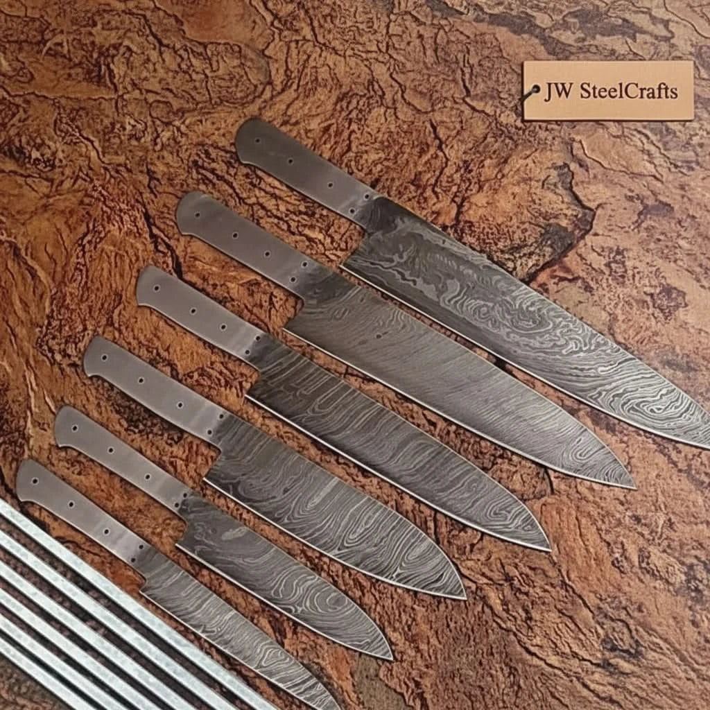 Prehandle Damascus blade collection showing drilled tangs and patterned steel profiles
