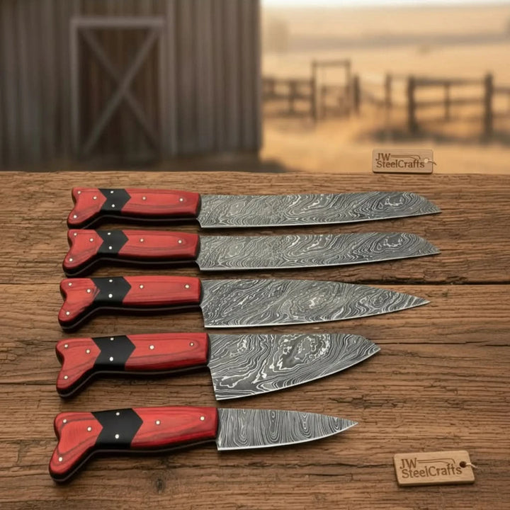 Handmade Damascus chef knives with sharp steel blades and polished wooden grips.