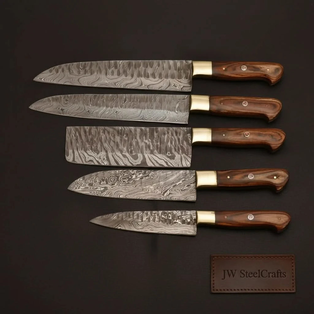 Decorative Damascus cooking knives with ergonomic wooden grips and precision sharpened cutting edges.