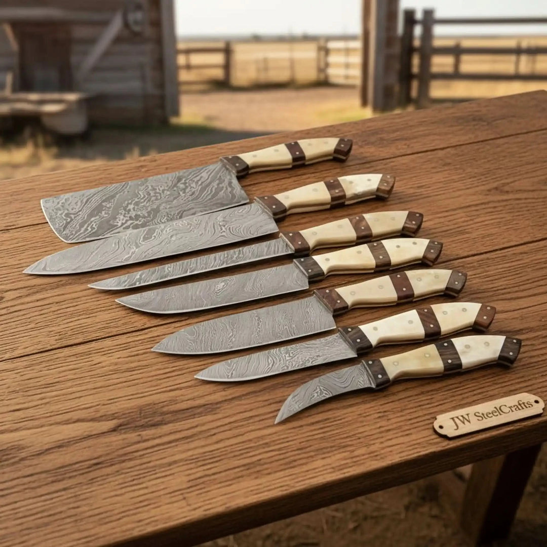 Ivory grip cooking blades with dark wood accents and sharp steel cutting edges.