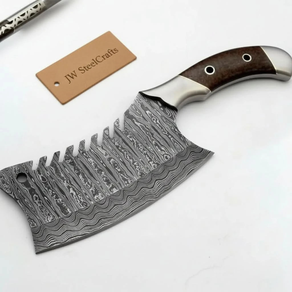 Artisan cleaver knife on white backdrop with layered steel blade and polished handle caps