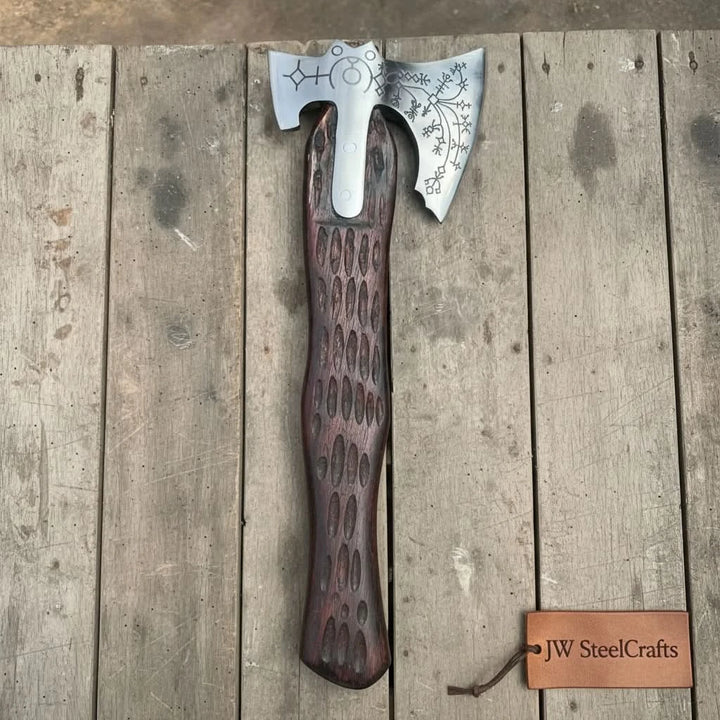 Thunder-inspired Nordic hand axe with polished etched steel and dark carved hardwood craftsmanship.