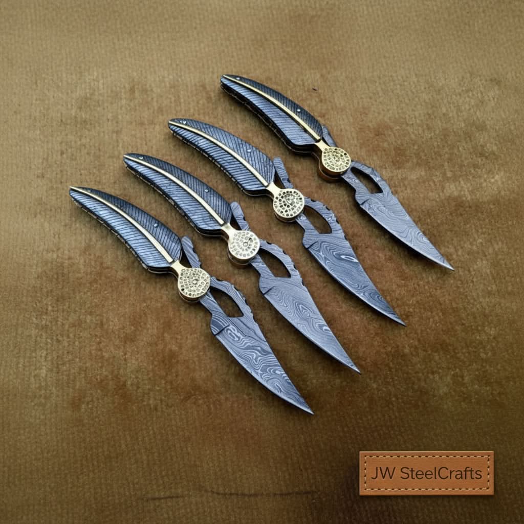     Nightfang custom Damascus folding knives with golden pivot style and sharp precision cutting blade edges