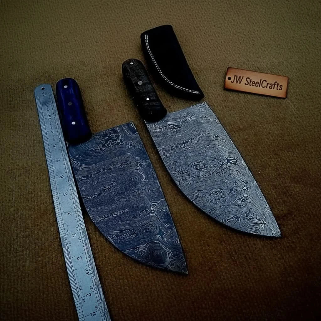 Dark background cleaver ruler photo with two Damascus blades and a black leather sheath