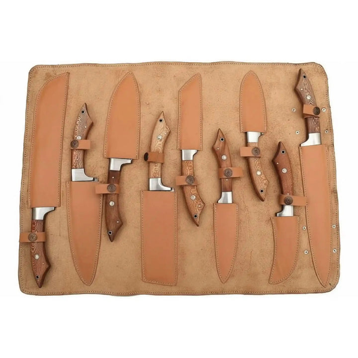 Tan suede chef tool storage layout displaying multiple kitchen knife shapes and lengths.
