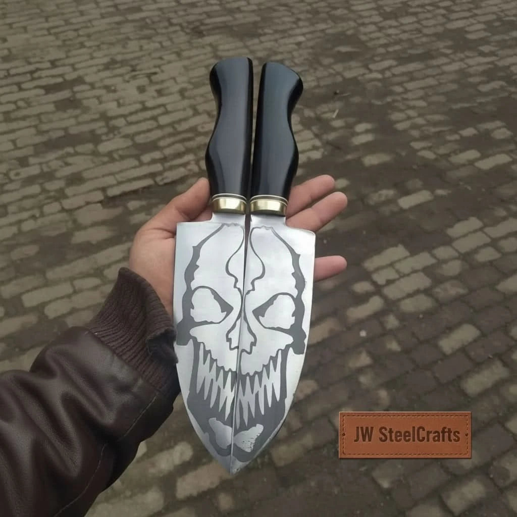Double blade skull pattern knives forming a face design across two matching blades