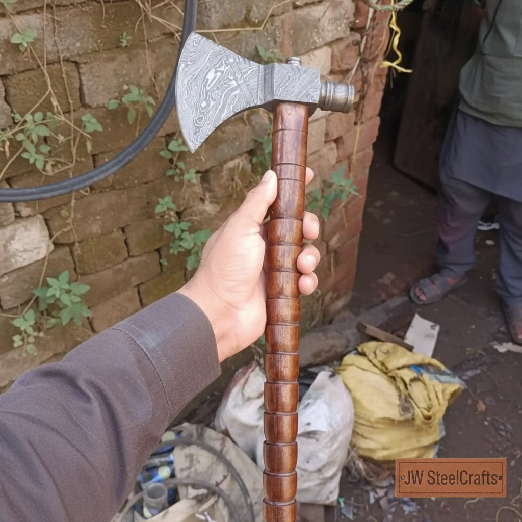Unique Damascus woodcraft axe featuring wave-pattern steel and elegant hardwood grip.