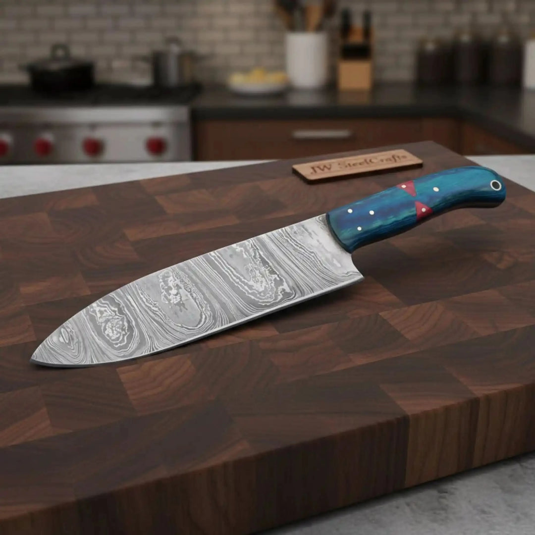 Walnut board custom Damascus cutter resting diagonally with colorful handle details