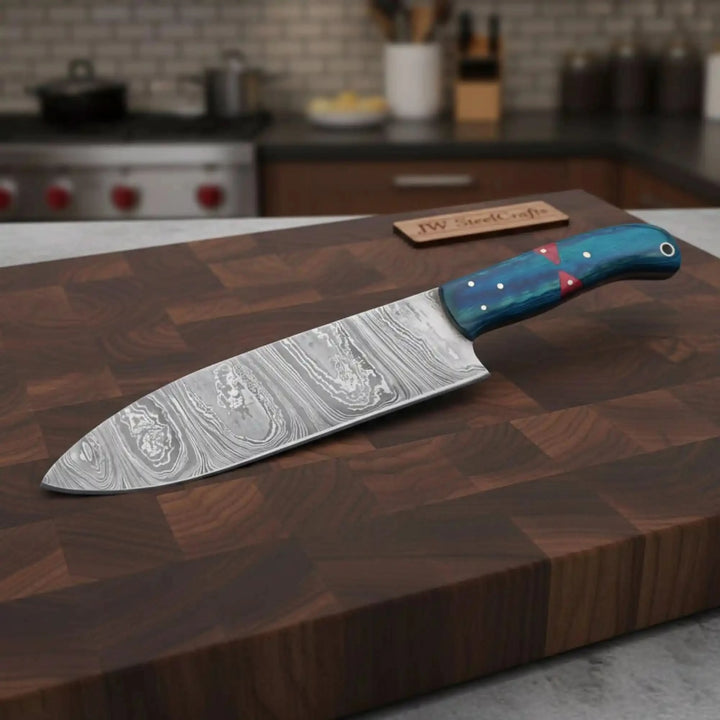 Walnut board custom Damascus cutter resting diagonally with colorful handle details