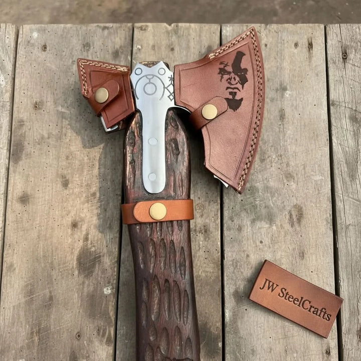 Velvet-themed Norse engraved axe with decorative steel carvings and handcrafted wooden handle textures.