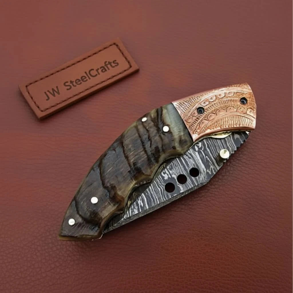     Bold Damascus pocket knife styled with rugged wood scales and decorative layered steel blade