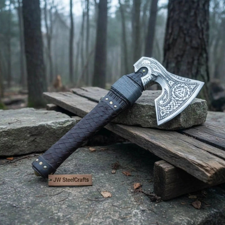 Premium engraved Viking war axe showcasing intricate Celtic patterns and handcrafted leather details.