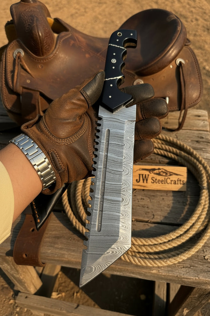 Hand Holding Voyager Vanguard Handmade Damascus Steel Hunting Tracker Knife With A Wooden Surface Next To A Leather Saddle And Rope