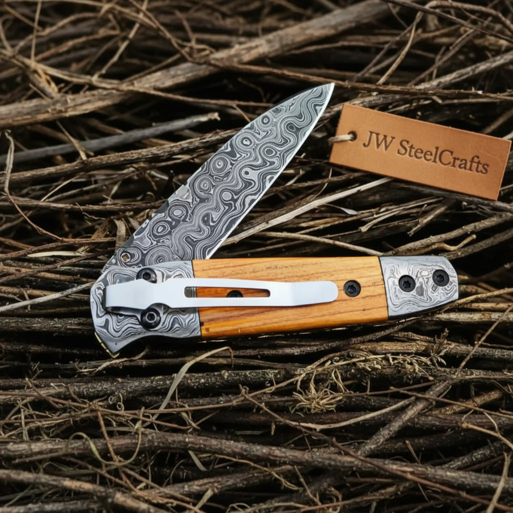     Distinctive Damascus folding knife featuring natural wood detail and handcrafted steel blade texture