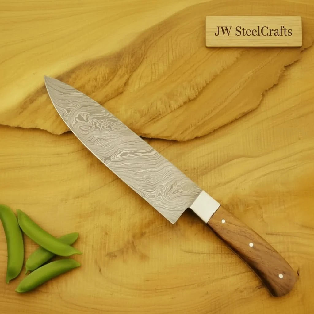 Damascus cooking knife displayed on a rustic wood background with detailed steel grain.