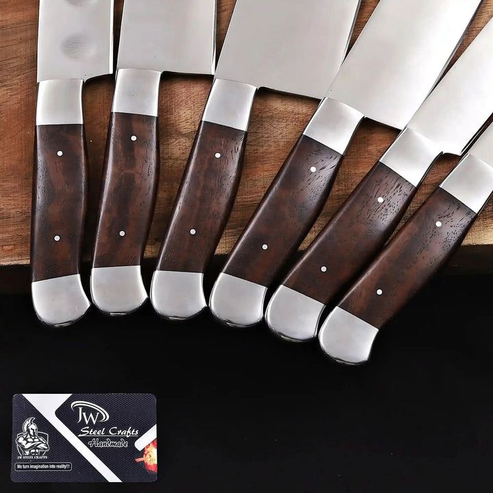 Close up of wooden handles on handmade 6 piece full tang chef knife set