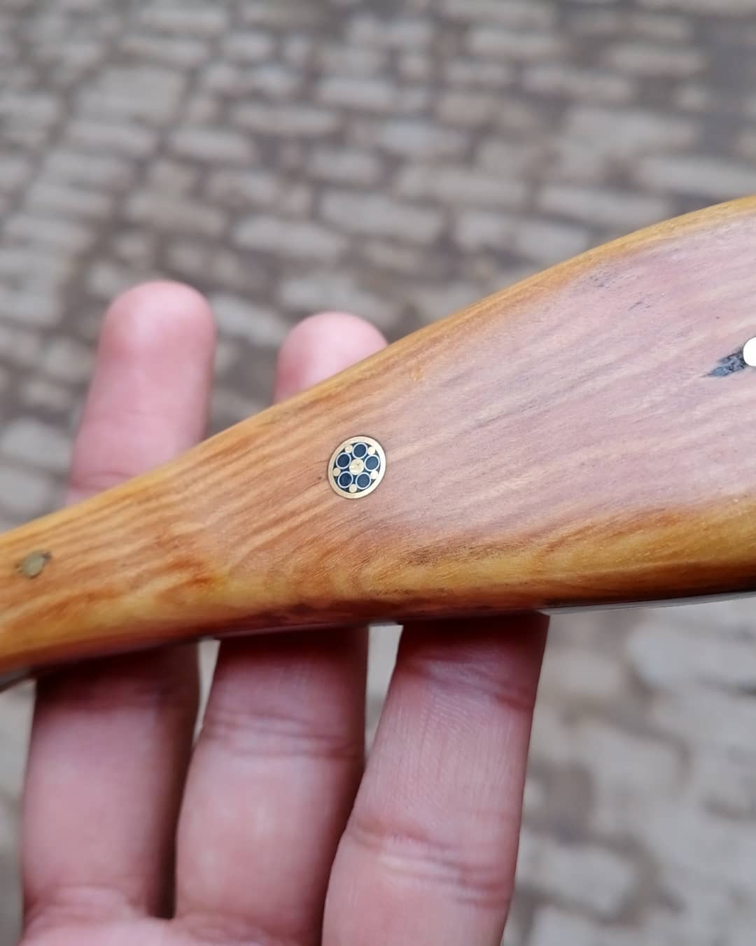 Damascus skinner knife with wood on handle.