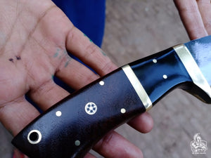 Gut hook knife with wood and brass handle.