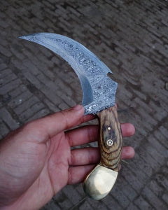 Damascus karambit knife..