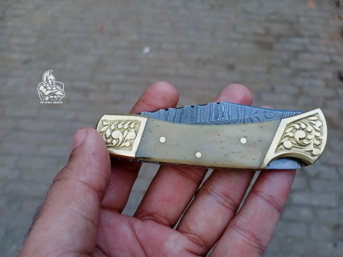 Folding Pocket Knife with bone and brass Handle.