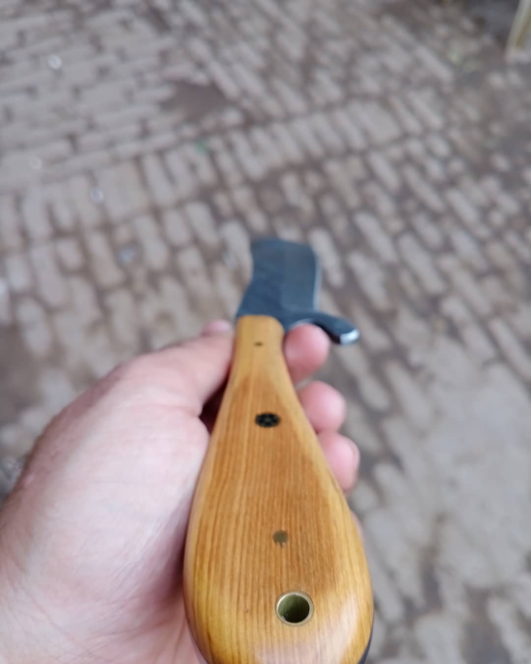 Damascus skinner knife with wood on handle.