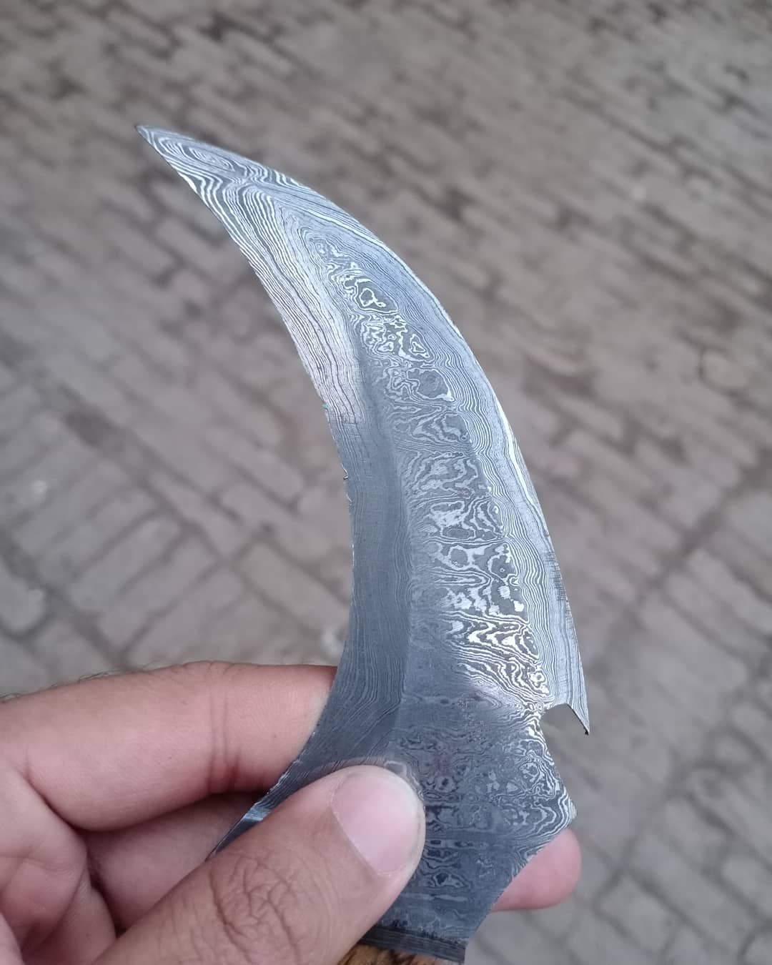 Damascus karambit knife..