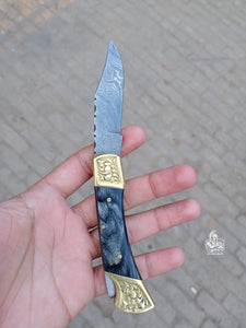 Folding pocket knife with color wood handle.
