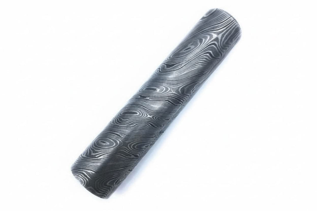 Damascus steel round bar with visible layered pattern for custom knife making and metalworking projects