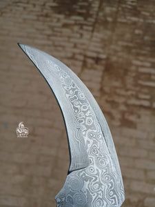 Karambit Knife with Black horn and Stainless steel handle.