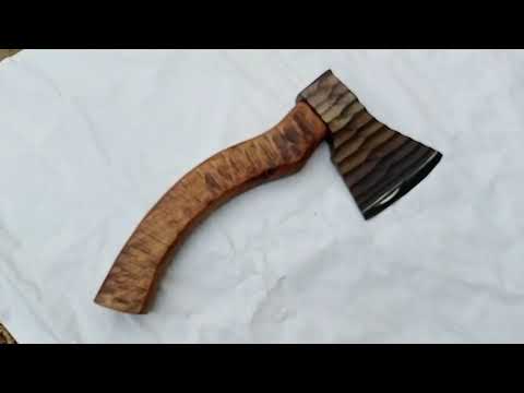 Grimshade-inspired Viking forged weapon video displaying dark sculpted steel blade and premium carved hardwood handle.