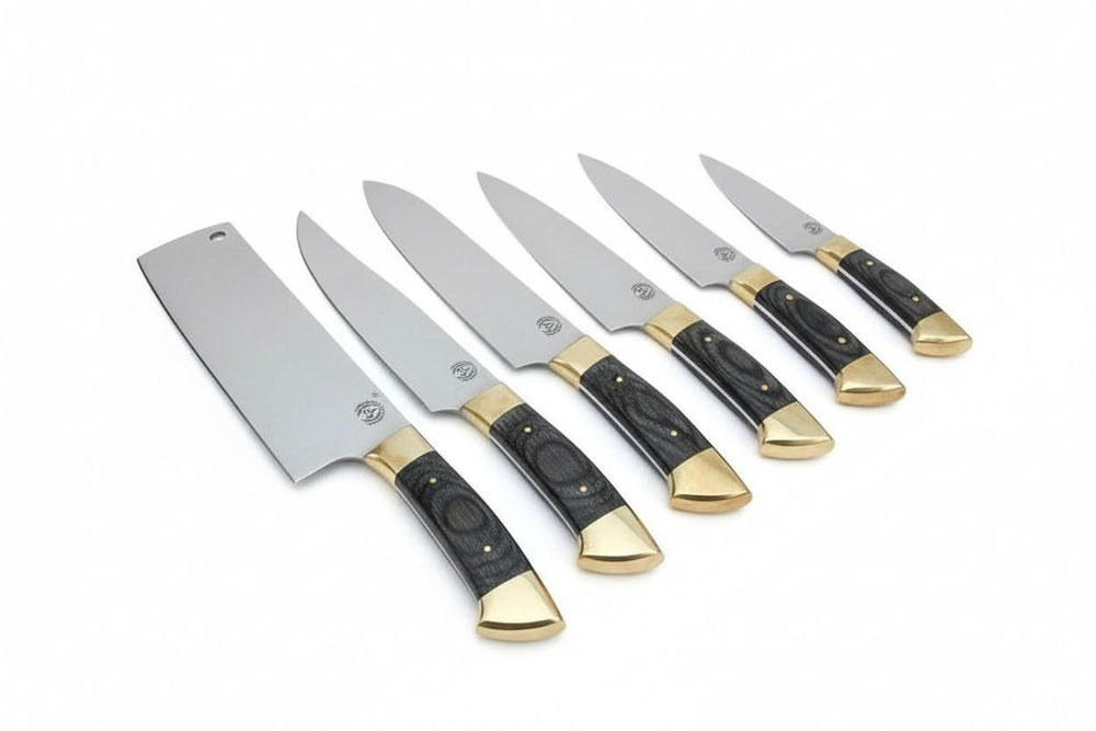 Brass bolsters and end caps add a refined touch to the professional cutlery collection chef knife set with sleek steel blades and black grip handles accented by brass end caps.

